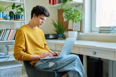 young man using laptop computer